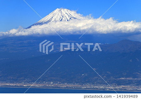 Mount Fuji with its snow-capped peaks, as seen from the summit of Mount Daruma on the Izu Mountain Ridge Trail of the Izu Peninsula. Mount Fuji with its snow-capped peaks, as seen from the summit of Mount Daruma on the Izu Mountain Ridge Trail of the Izu Peninsula. 141939489