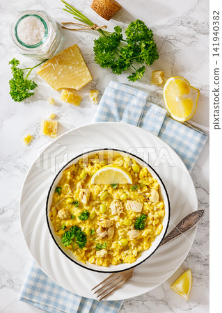 Creamy saffron chicken risotto in a bowl, top view Creamy saffron chicken risotto in a bowl, top view 141940382