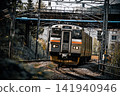 Hankyu train running near Ashiya Station in the evening. 141940946