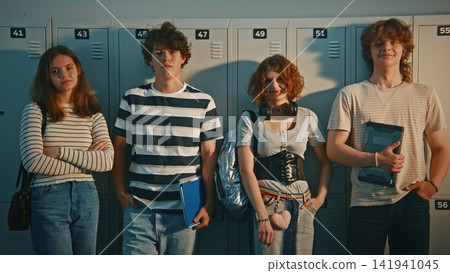 Group of Diverse High School Friends Chatting by Lockers During Break Group of Diverse High School Friends Chatting by Lockers During Break 141941045