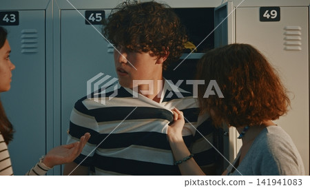 Aggressive Teen Girl Grabbing Boy by T Shirt During School Fight Aggressive Teen Girl Grabbing Boy by T Shirt During School Fight 141941083