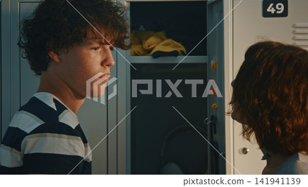 Aggressive Teen Girl Grabbing Boy by T Shirt During School Fight Aggressive Teen Girl Grabbing Boy by T Shirt During School Fight 141941139