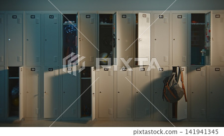 Quiet School Hallway Lined With Metal Lockers Before Students Arrive Quiet School Hallway Lined With Metal Lockers Before Students Arrive 141941345
