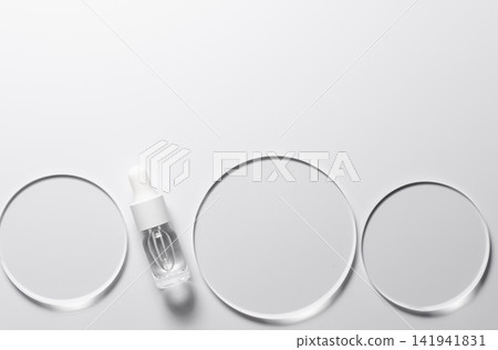 Glass circles on a white background. A template for placing samples of cosmetics or medical products or food. Glass circles on a white background. A template for placing samples of cosmetics or medical products or food. 141941831