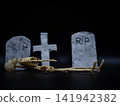 Skeleton in Halloween cemetery black background 141942382