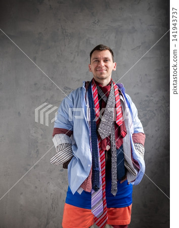 Funny man in multiple shirts and neckties looking forward Funny man in multiple shirts and neckties looking forward 141943737