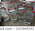 Shopping carts left haphazardly outside the store 141944591