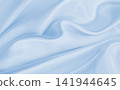 Smooth elegant blue silk or satin luxury cloth texture as abstract background. Luxurious background design 141944645