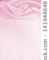 Smooth elegant pink silk or satin texture as wedding background. Luxurious background design 141944646