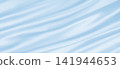 Smooth elegant blue silk or satin luxury cloth texture as abstract background. Luxurious background design 141944653
