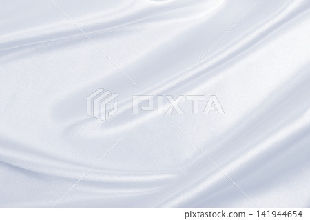 Smooth elegant grey silk or satin luxury cloth as wedding background. Luxurious background design Smooth elegant grey silk or satin luxury cloth as wedding background. Luxurious background design 141944654