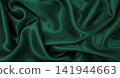 Smooth elegant green silk or satin luxury cloth texture as abstract background. Luxurious background design 141944663