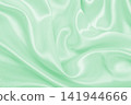 Smooth elegant green silk or satin luxury cloth texture as abstract background. Luxurious background design 141944666