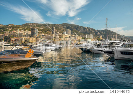 Speed motorboats in parking lots and panorama of Monte Carlo (Central part of Monaco) Speed motorboats in parking lots and panorama of Monte Carlo (Central part of Monaco) 141944675