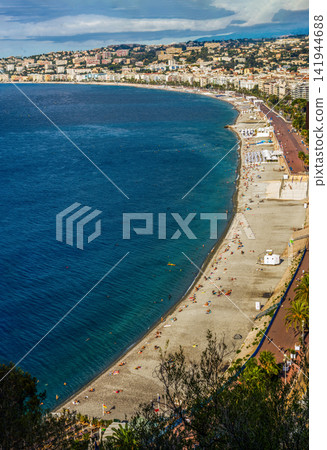 Aerial view on Prom. des Anglais in sunny summer day with sunbathing and swimming people Aerial view on Prom. des Anglais in sunny summer day with sunbathing and swimming people 141944688