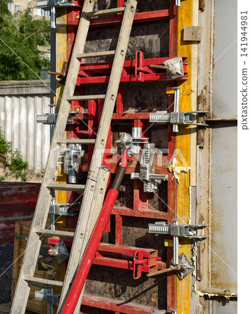 Construction site featuring reinforced concrete bridge column pouring with adjustable formwork systems showcasing civil engineering progress and durable infrastructure creation Construction site featuring reinforced concrete bridge column pouring with adjustable formwork systems showcasing civil engineering progress and durable infrastructure creation 141944981