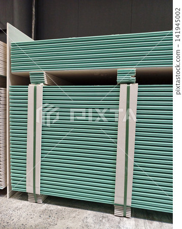 Blue gypsum plasterboards in the warehouse of the manufacturer Blue gypsum plasterboards in the warehouse of the manufacturer 141945002