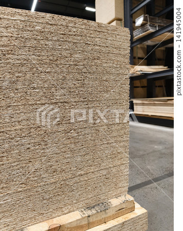 Oriented Strand Board or OSB, plate for frame house installation and wall structure displayed in construction retail center Oriented Strand Board or OSB, plate for frame house installation and wall structure displayed in construction retail center 141945004