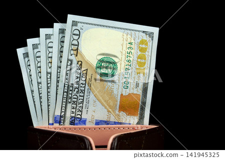 Black wallet with a fresh stack of hundred-dollar bills, symbolizing wealth and financial stability. New 100 dollar bills, USD Black wallet with a fresh stack of hundred-dollar bills, symbolizing wealth and financial stability. New 100 dollar bills, USD 141945325