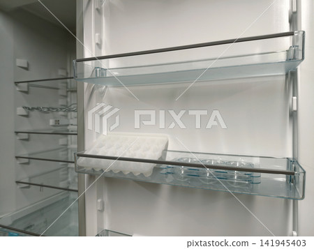 Spacious fridge with open door, ideal for large households, now available in home appliance store 141945403