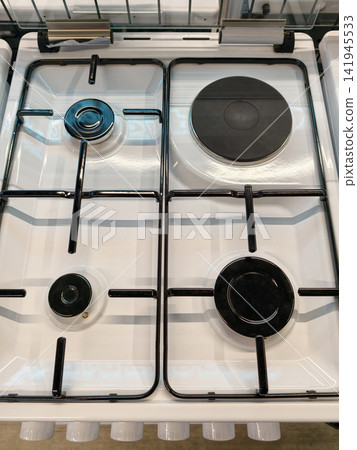 New white kitchen gas stove with four burners one electric from above in store 141945533