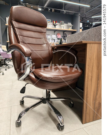 Brown faux leather office chair with rolling wheels and adjustable height, sold at a megastore Brown faux leather office chair with rolling wheels and adjustable height, sold at a megastore 141945579