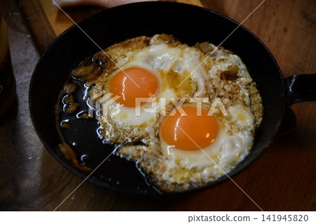 sausages on a plate with scrambled eggs and bacon , kitchen breakfast, morning sausages on a plate with scrambled eggs and bacon , kitchen breakfast, morning 141945820