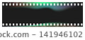 Set of 35mm film frames with multicolor aurora light leaks. Vintage film strip with sprocket holes, dust and scratches. Retro analog camera aesthetic with green and purple flares for photo overlay. 141946102