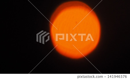 Solar Eclipse, Red Sky and Dramatic Clouds at Sunset 141946376