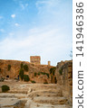 Historic stone ruins under blue sky Historic stone ruins under blue sky 141946386