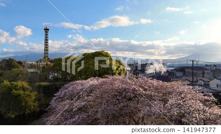 A spring scene at Ryuganbuchi in Fuji City, featuring cherry blossoms in full bloom and a chimney. A spring scene at Ryuganbuchi in Fuji City, featuring cherry blossoms in full bloom and a chimney. 141947377