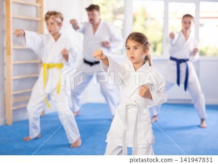Family with children training karate techniques Family with children training karate techniques 141947831