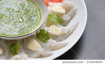 shrimp in fish sauce with Thai spicy seafood dipping sauce on white plate shrimp in fish sauce with Thai spicy seafood dipping sauce on white plate 141948004
