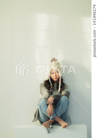 Portrait of a woman wearing a knitted hat Portrait of a woman wearing a knitted hat 141948274