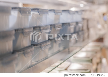 Storage containers and kitchenware displayed in stores Storage containers and kitchenware displayed in stores 141949352