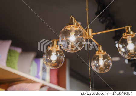 Glass sphere light fixtures hanging in a general store Glass sphere light fixtures hanging in a general store 141949394