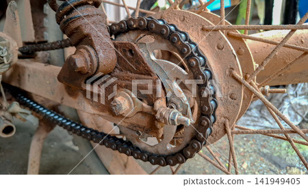 Rusted Motorcycle Chain and Sprocket Covered in Dry Mud Rusted Motorcycle Chain and Sprocket Covered in Dry Mud 141949405