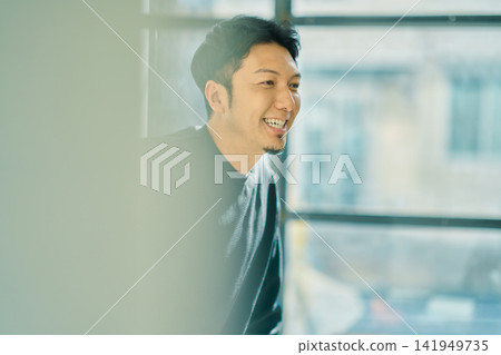 A man working on a computer A man working on a computer 141949735