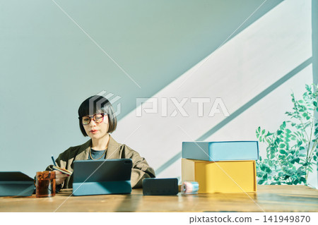 Young woman working in the office Young woman working in the office 141949870