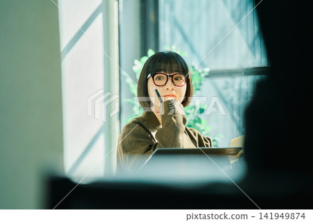 Young woman working in the office Young woman working in the office 141949874