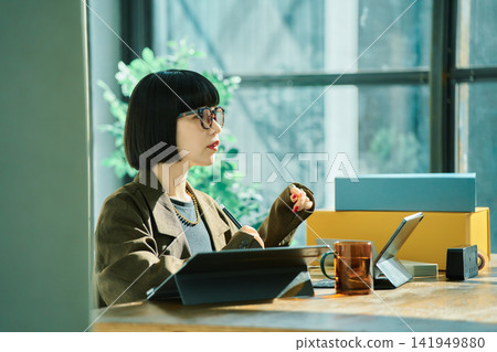 Young woman working in the office Young woman working in the office 141949880