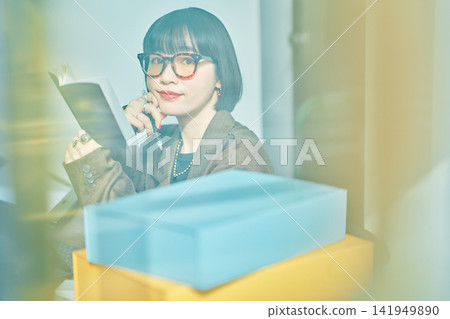 Young woman working in the office Young woman working in the office 141949890