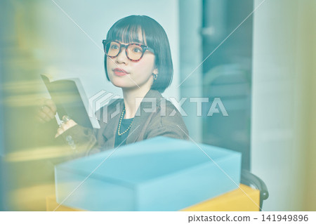 Young woman working in the office Young woman working in the office 141949896