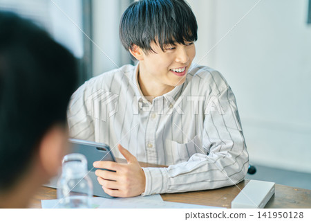 A man having a meeting A man having a meeting 141950128