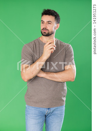 Adult man drinking coffee in front of green screen Adult man drinking coffee in front of green screen 141951273