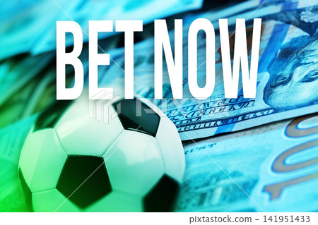 Bet now on sports betting with cash and soccer ball in a local setting Bet now on sports betting with cash and soccer ball in a local setting 141951433