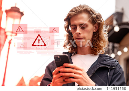 Person receives emergency alerts on smartphone while outside in city during evening hours Person receives emergency alerts on smartphone while outside in city during evening hours 141951568