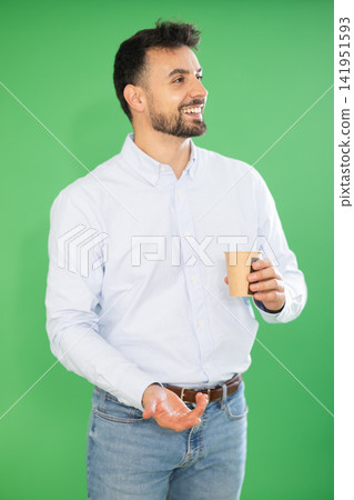 Young man and coffee break on green screen background Young man and coffee break on green screen background 141951593