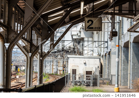 Station platform and track scenery; sign for platform 2 and steel roof. 141951646