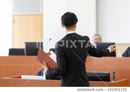 The back view of a male lawyer arguing in court. 141952155